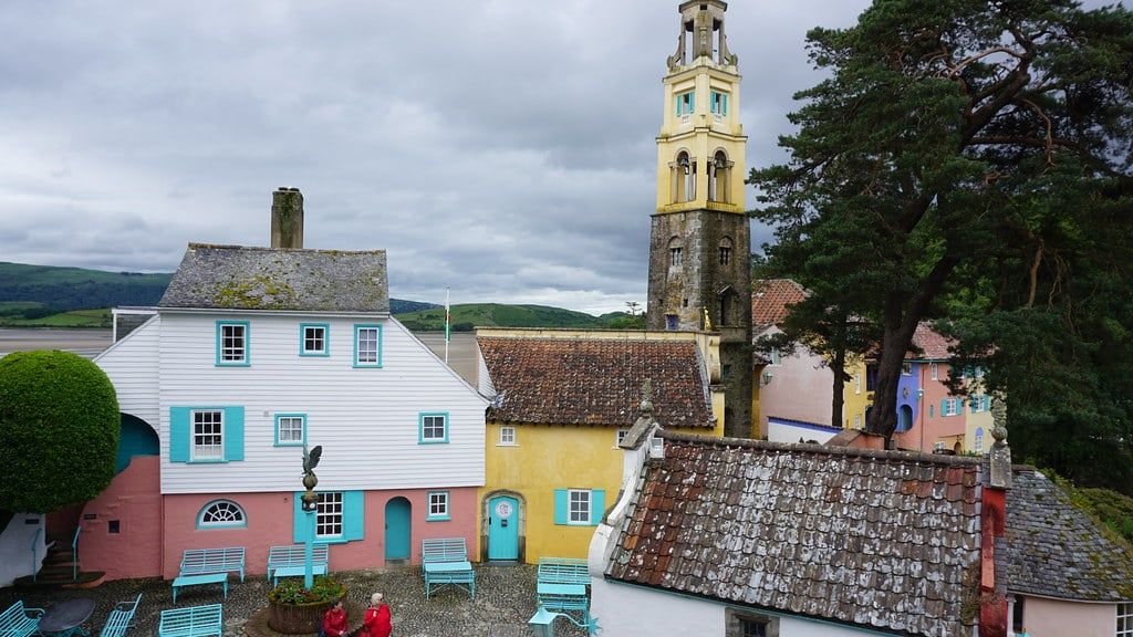 Pastel-coloured Italianate cottages and the campanile bell tower in Portmeirion village near Snowdonia.